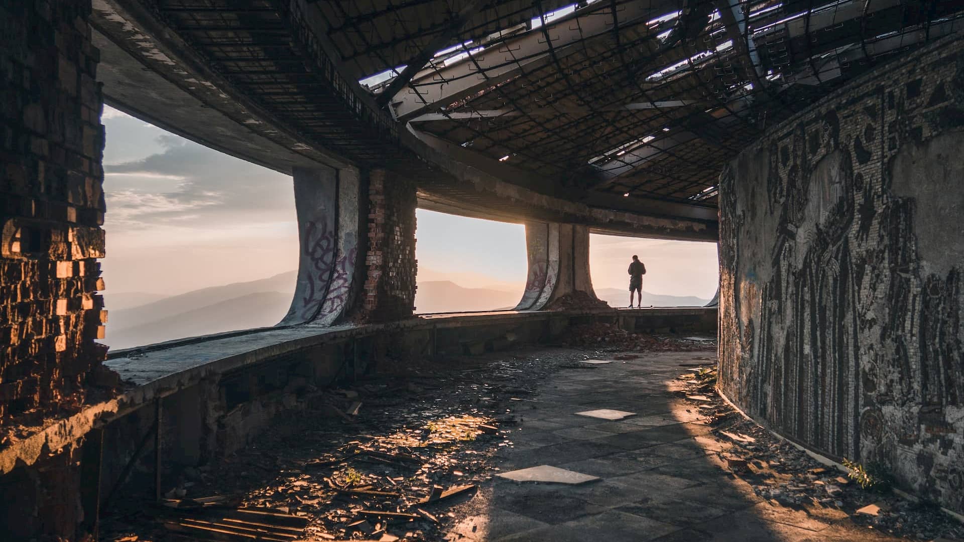 View from within the ruins of the Monument House of he Bulgarian Communist Party, built on Buzludzha Peak in central Bulgaria. Photo by Natalya Letunova on Unsplash